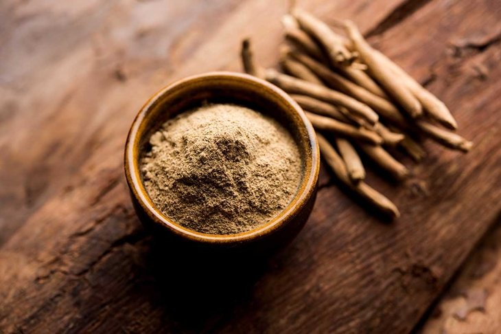 Ashwagandha / Aswaganda OR Indian Ginseng is an Ayurveda medicine in stem and powder form. Isolated on plain background. selective focus